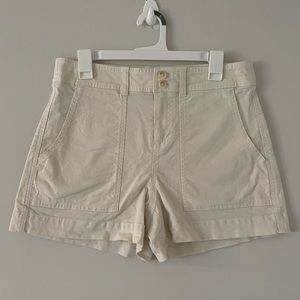 White shorts, size 8. with pockets on front and back. A new day.